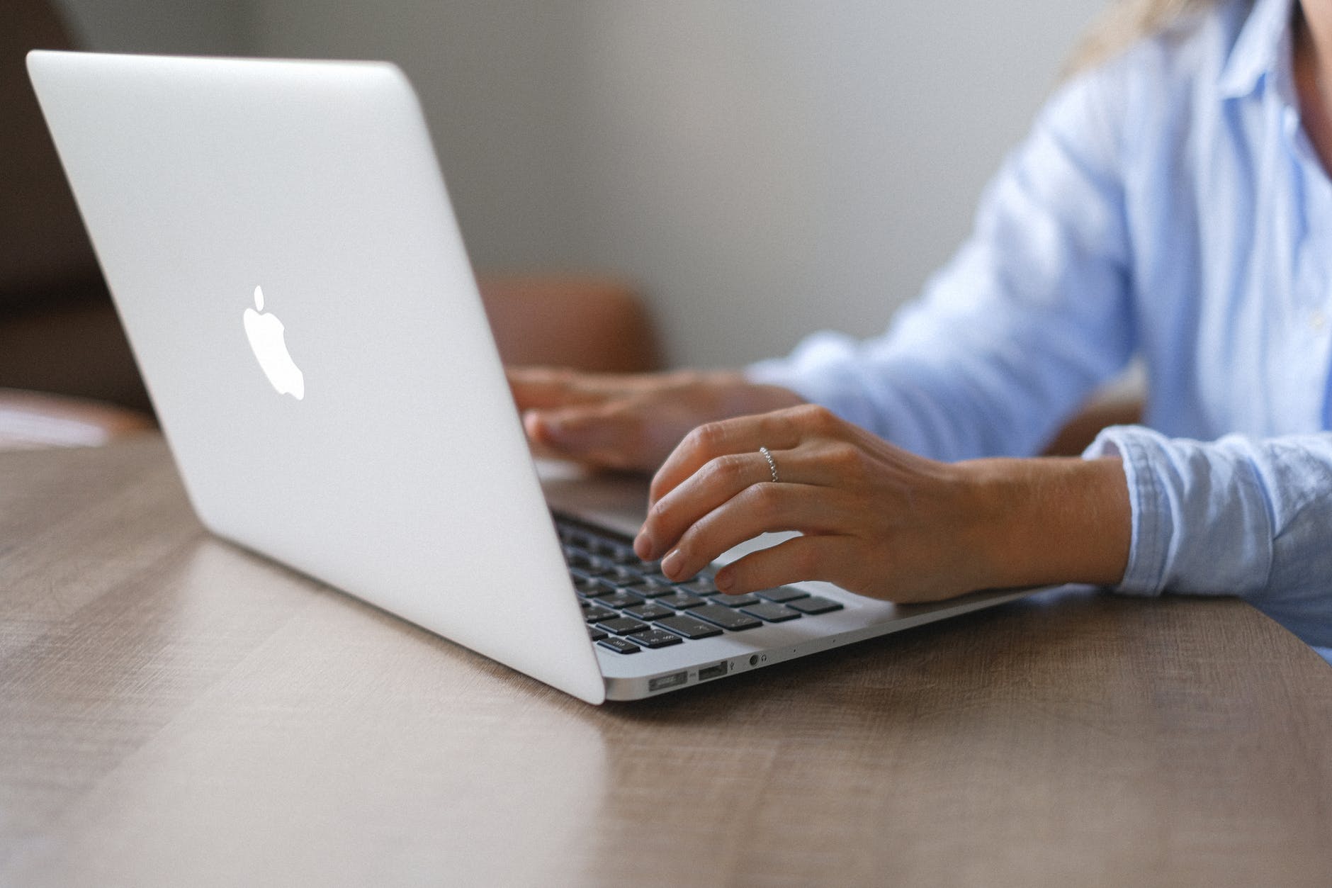 crop lady surfing information for work on modern computer